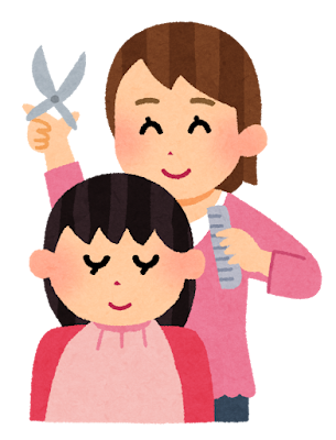 女性の美容師が髪を切る